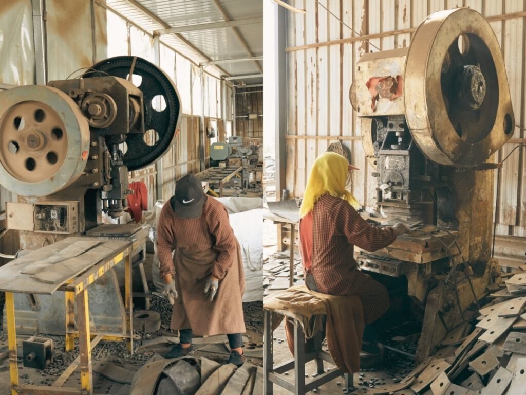 Two technicians assembling heavy-duty dock bumpers in LEYA factory
